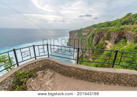 Landscape in Uluwatu Temple Bali Indonesia.
Landscape of high cliff with sunset sky at Uluwatu Temple Bali Indonesia.