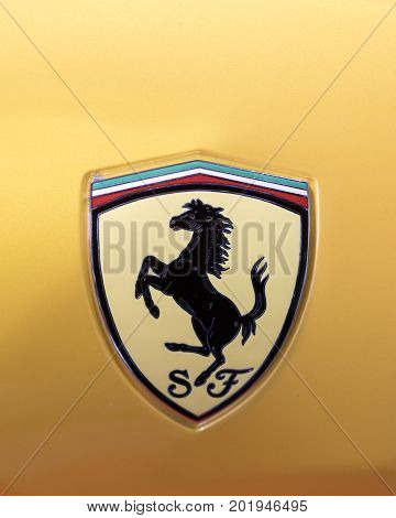 CRACOW POLAND - MAY 20 2017: Ferrari metallic logo closeup on Ferrari car displayed at 3rd edition of MOTO SHOW in Cracow Poland. Exhibitors present most interesting aspects of the automotive industry