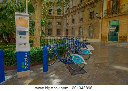 PALMA DE MALLORCA, SPAIN - AUGUST 18 2017: Free public rental bikes parked in a rack in Palma de Mallorca, Balearic islands, Spain.
