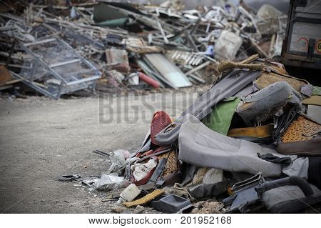 Detail of car waste metal and plastic parts on the stack
