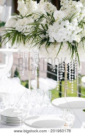 Detail of a table dish with glasses at an event on a sunny summer day. party in a Villa on the shore of the sea
