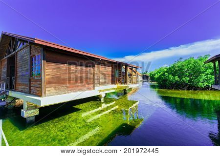 Cayo Coco island, Cuba, Iberostar Mojito resort, July 17, 2017, gorgeous, amazing inviting view of hotel grounds with villa houses standing in natural sea water in tropical garden on sunny great day