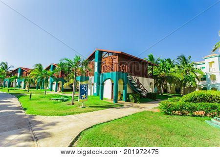 Cayo Coco island, Cuba, Iberostar Mojito resort, July 17, 2017, nice amazing view of hotel grounds with villa houses standing in tropical garden on sunny beautiful day