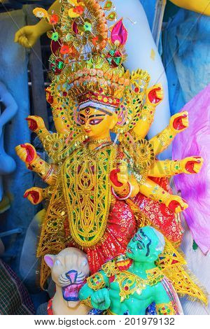 KOLKATA WEST BENGAL INDIA - 25 SEPTEMBER 2016: Clay idol of Goddess Durga under preparation for "Durga Puja' festival in Kumartuli Kolkata. Biggest festival of Hinduism.