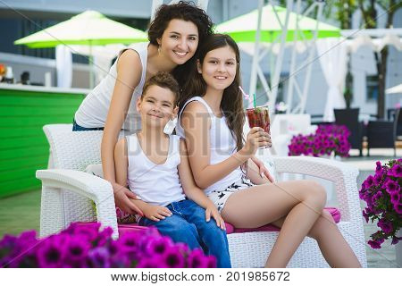 Family On Vacation Having Fun at Outdoor Pool.