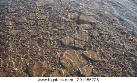 the texture of the stone bottom of the river