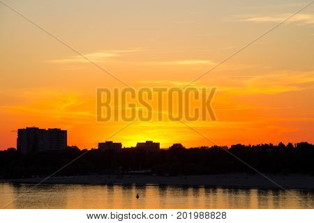 Orange Sunset Over A River Dnieper In Kremenchug City, Ukraine