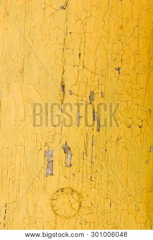 Yellow Wooden Background Of Cracked Surface. Wooden Background Painted In Yellow. Abstract Pattern I
