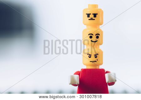 Kyiv, Ukraine - March 15, 2019: Red Lego Figurine With Indifferent, Smiley And Angry Faces On Heads 