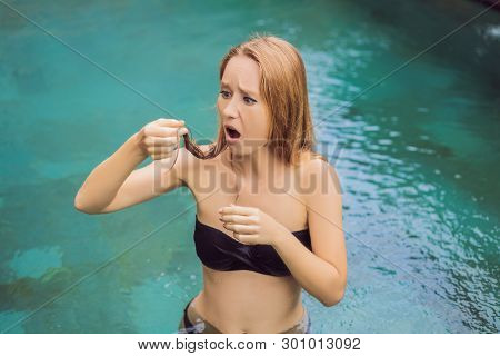 Frustrated Young Woman Having A Bad Hair In The Pool. Due To The Fact That Chemicals In The Pool
