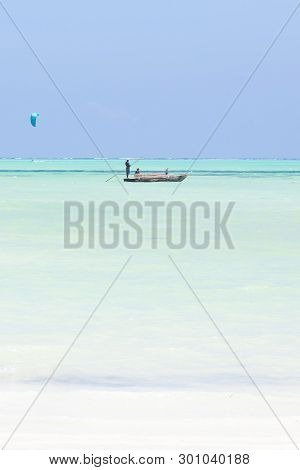 Fishing Boat And A Kite Surfer On Picture Perfect White Sandy Beach With Turquoise Blue Sea, Paje, Z
