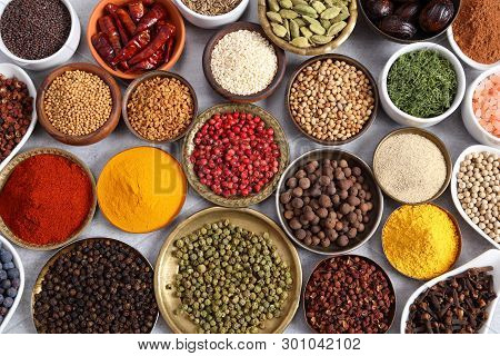 Aromatic Spices And Herbs In Metal And Ceramic Bowls. Top View.