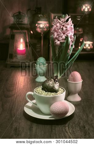 Delicate Pink Hyacinth On Vintage Kitchen With Candles And Easter Eggs, This Image Is Toned