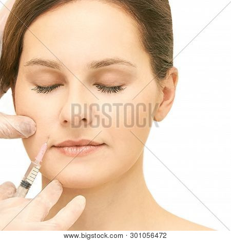 Woman Face Cosmetology Treatment. Biorevitalization Skin Therapy. Doctor Insert Filler. Girl Clinic