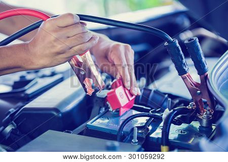 Selective Focus Charging Car With Electricity Trough Cables.