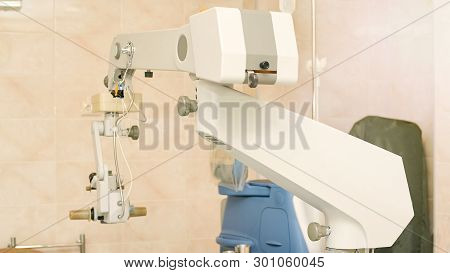 Ophthalmology Laser Microscope Operation. Clinic Room With Doctor And Parient. Gloves And Medicine T