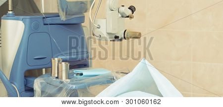 Ophthalmology Laser Microscope Operation. Clinic Room With Doctor And Parient. Gloves And Medicine T