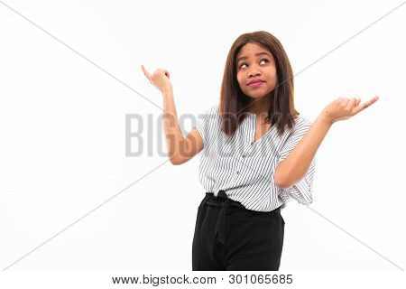 Portrait Of African Young Girl Possing And Gesticulates Hands On Background