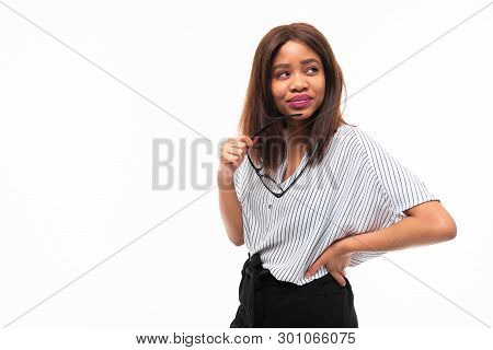Portrait Of Attractive Young Afro-american Girl Possing With Glasses On Background