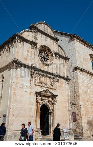 Dubrovnik, Croatia - April, 2018: Tourists At The Church Of St. Spasa Located At Stradun Street In T