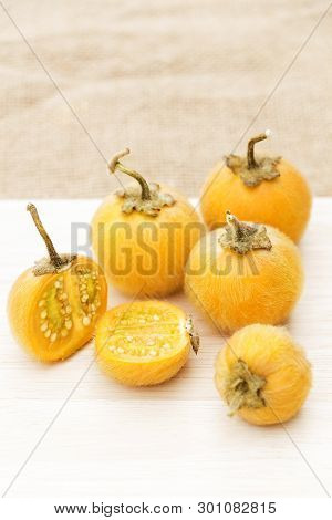 Solanum Stramonifolium Or Coconilla Fruit. Food Ingredient And Herb For Healthy On Chopping Wood And