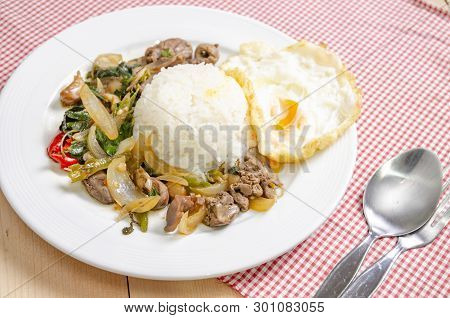 Fried Rice With Basil Leaves And Red Cloth On The Table.ngredients Of Basil Fried Chicken And Fried 