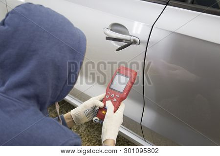 The Opening Of The Vehicle With The Scanner. Carjacking. Hijacker.