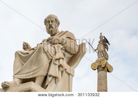 Statue Of Plato And Goddess Athena Against Cloudy Sky, Athens, Greece