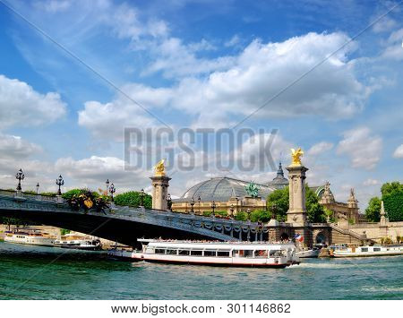 Paris, France, Passenger Ship Passes Under Alexander Iii Bridge On Seine River On A Bright Day In Sp