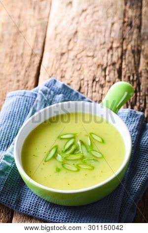 Cream Of Green Asparagus Soup In Bowl, Garnished With Sliced Asparagus On Top, Copy Space On The Top