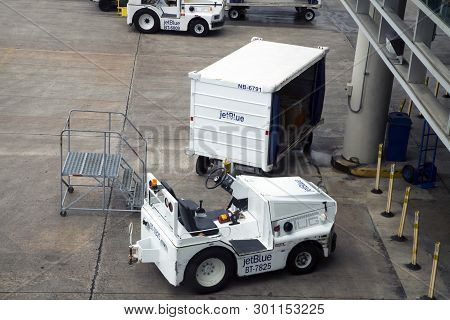 Carolina, Puerto Rico - February 28, 2019:  Jet Blue Ground Support Equipment And Vehicle At San Jua