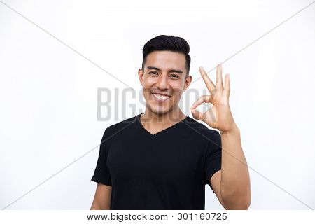 Happy Excited Young Man Making Okay Sign With Fingers. Isolated On White Background.