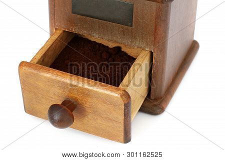 Manual Coffee Grinder On A White Background. Antiquary