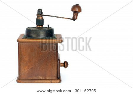 Manual Coffee Grinder On A White Background. Antiquary