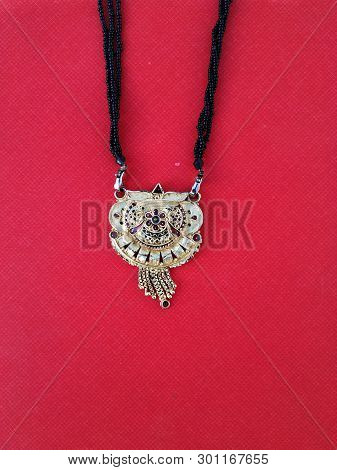 Decorative Mangalsutra Or Golden Necklace For Woman To Wear In Hindu Marriage, Close-up Shot Of Mang