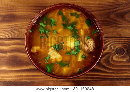 Kharcho Soup With Meat And Rice On Wooden Table. Top View