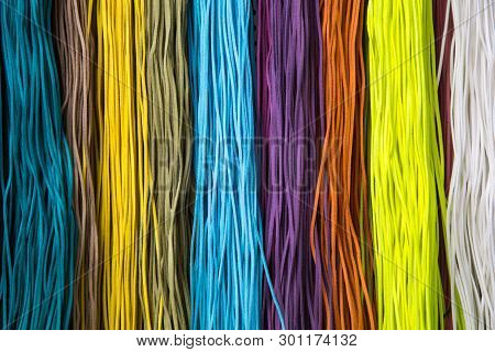Colorful Rope String Background. Colorful Background Of Leather Ropes. Fashionable Craft Of Women. M