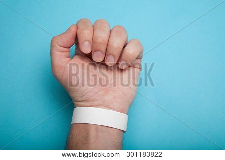 Empty Event Wristband On Hand, Mockup. Blue Background