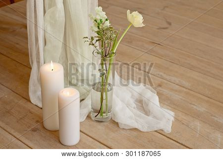Branch Of Blooming White Peony Tulip Mattiola Branch In A Glass Vase White Wax Candles Stand On The 
