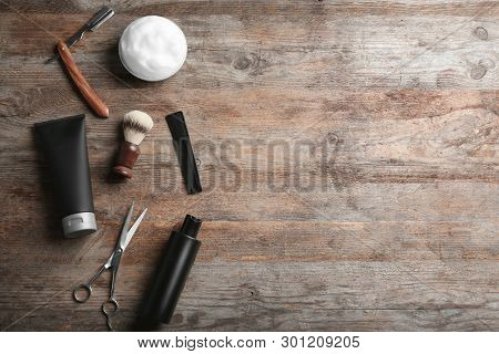 Flat Lay Composition With Men's Cosmetic Products On Wooden Background. Space For Design