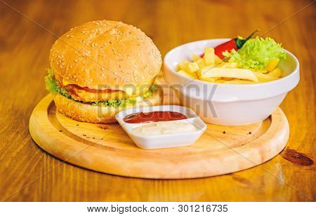 Cheat Meal. Delicious Burger With Sesame Seeds. Burger Menu. High Calorie Snack. Hamburger And Frenc