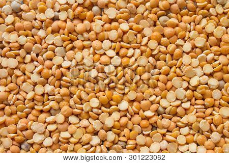 Dry Split Yellow Peas Background. Healthy Vegetarian Or Vegan Food Texture