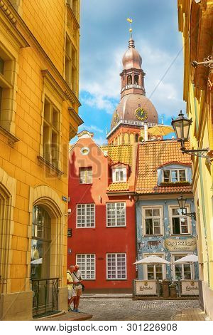 Riga, Latvia 05/17/2018 : Tourism In Riga, The View Of The Street In The Old Town And Riga Dom Cathe