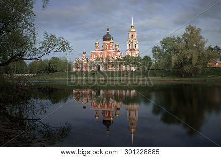 Resurrection Cathedral In Staraya Russa Is Reflected In The River. Spring Landscape.