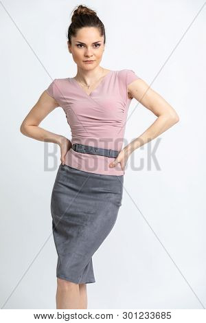 Model In Light Lilac Blouse, Grey Suede Skirt With Belt, Isolated On White Background.