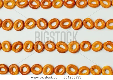 Drying Or Bagels On A White Background, Place For Text, Bright Colors, High Contrast.