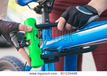 Bicycle Lime Green U- Lock In Hands