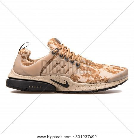 Vienna, Austria - August 10, 2017: Nike Air Presto Gpx Golden Beige And Black Sneaker On White Backg