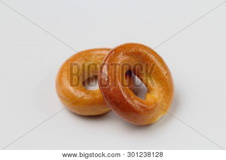 Two Delicious Crisp Drying On A White Background, Close-up, High Contrast, Bright Colors.
