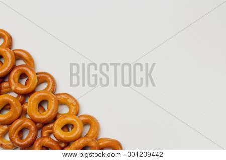 Appetizing Crispy Drying Or Bagels On A White Background, There Is A Place For Text. Bright Colors, 